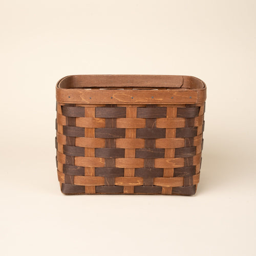 Large rectangular woven wood basket in two-tone brown with an open top and reinforced rim, shown against a neutral background.