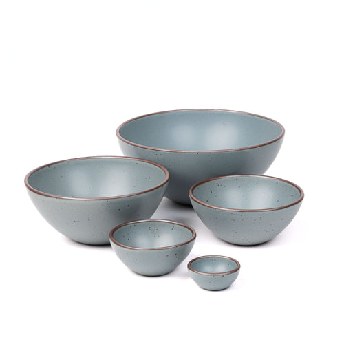 A bitty bowl, ice cream bowl, soup bowl, popcorn bowl, and mixing bowl in a blue-grey color featuring iron speckles