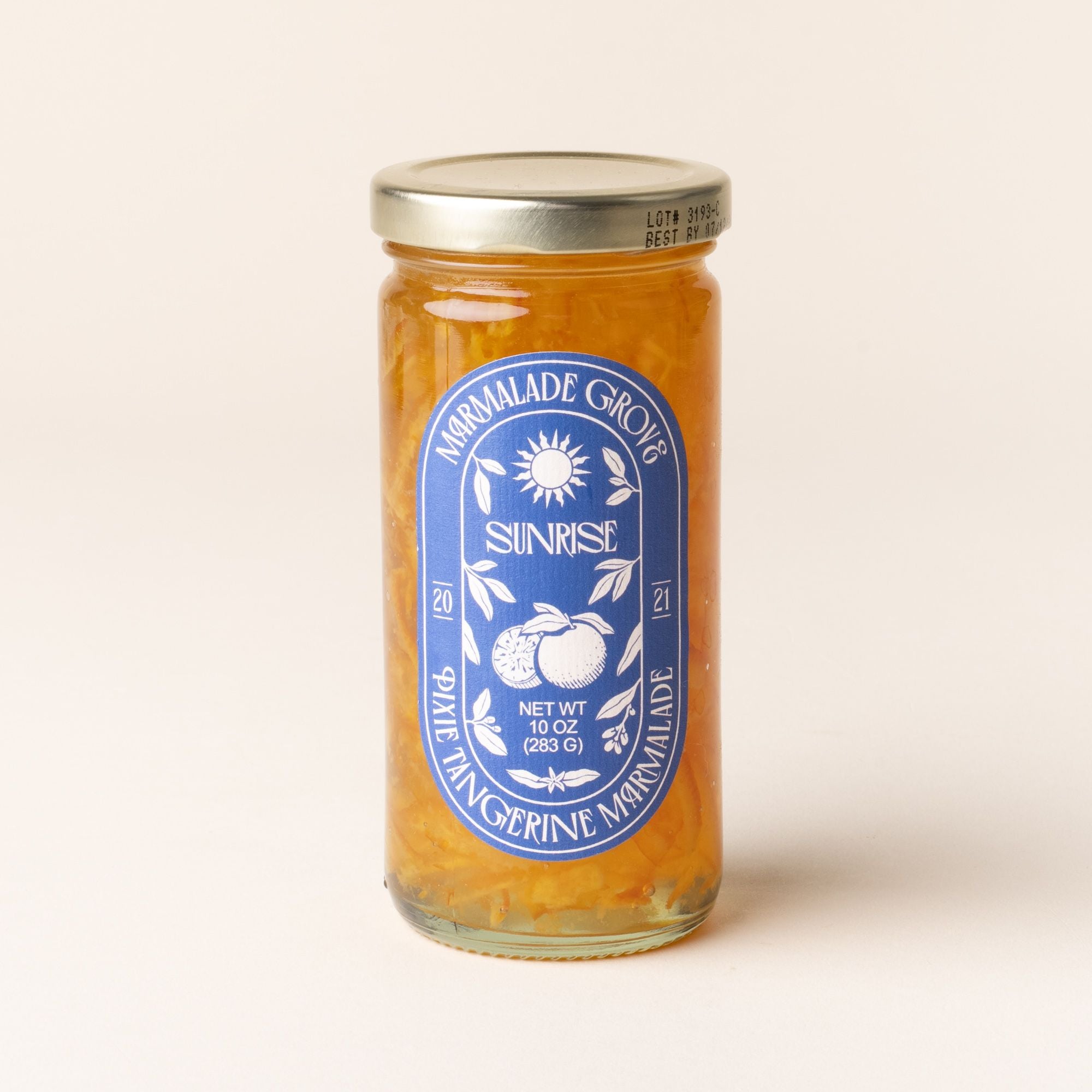 A jar of Marmalade Grove Sunrise Pixie Tangerine Marmalade, with a blue label featuring a sun and citrus illustration.
