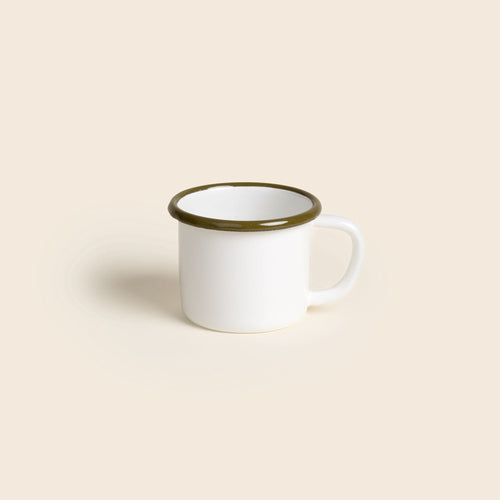A white enamel mug with an olive green rim and handle, shown against a neutral beige background.