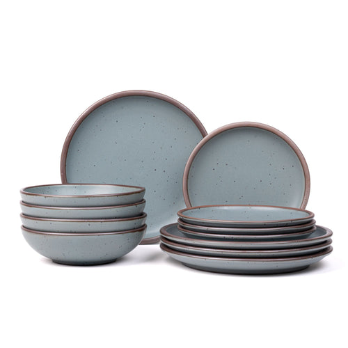4 ceramic dinner plates, 4 side plates, and 4 shallow dinner bowls in a blue-grey color with iron speckles and unglazed rims.