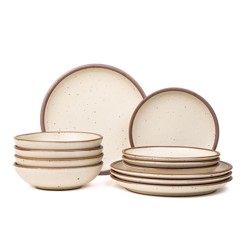 4 ceramic dinner plates, 4 side plates, and 4 shallow dinner bowls in a warm off-white color with iron speckles and unglazed rims.