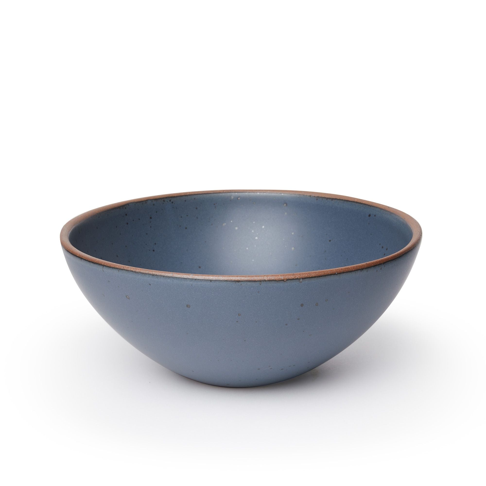 A large ceramic mixing bowl in a cool, medium blue color featuring iron speckles and an unglazed rim
