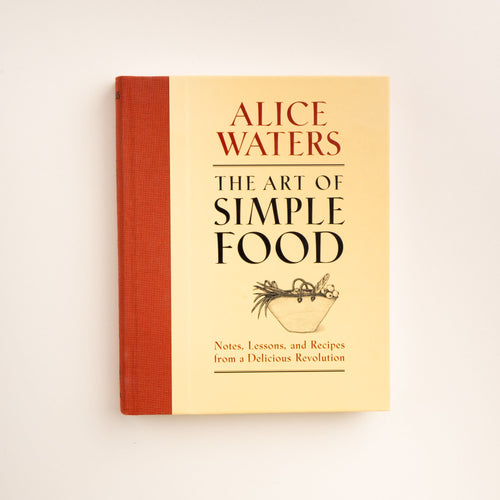 Cover of the book The Art of Simple Food by Alice Waters, featuring a yellow background, red spine, and a black line drawing of a bowl of vegetables.