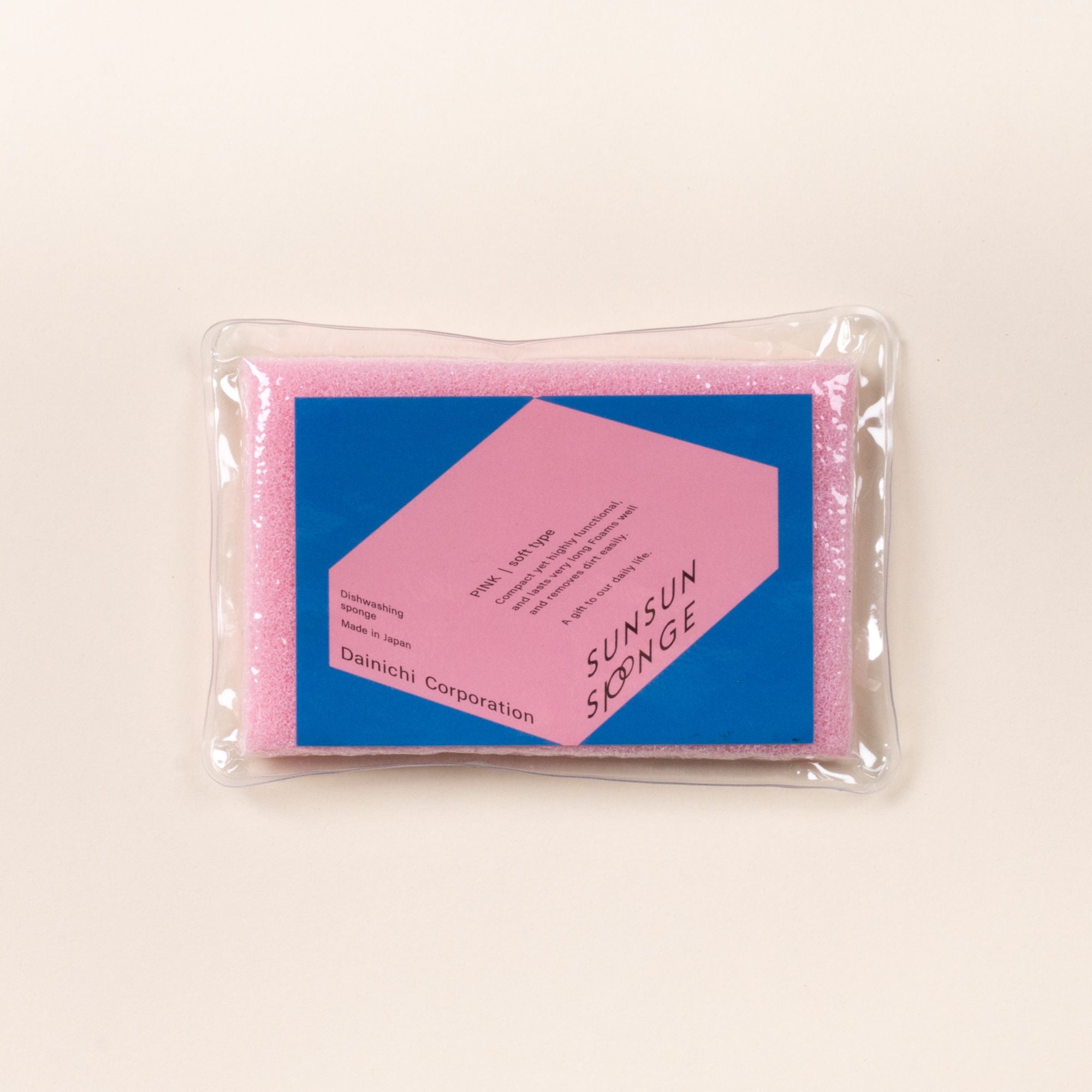 Pink dish sponge in clear packaging with a blue Sunsun Sponge label on a light background.