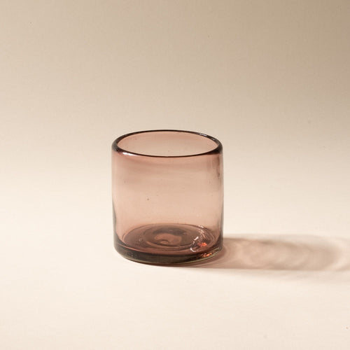 A light plum short transparent drinking glass