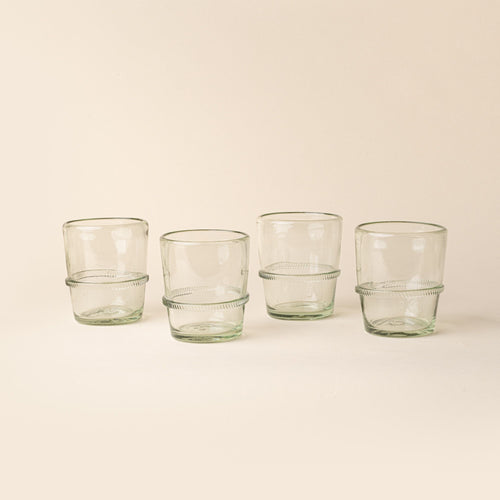 Set of four clear short recycled glass tumblers with a ridged band detail.