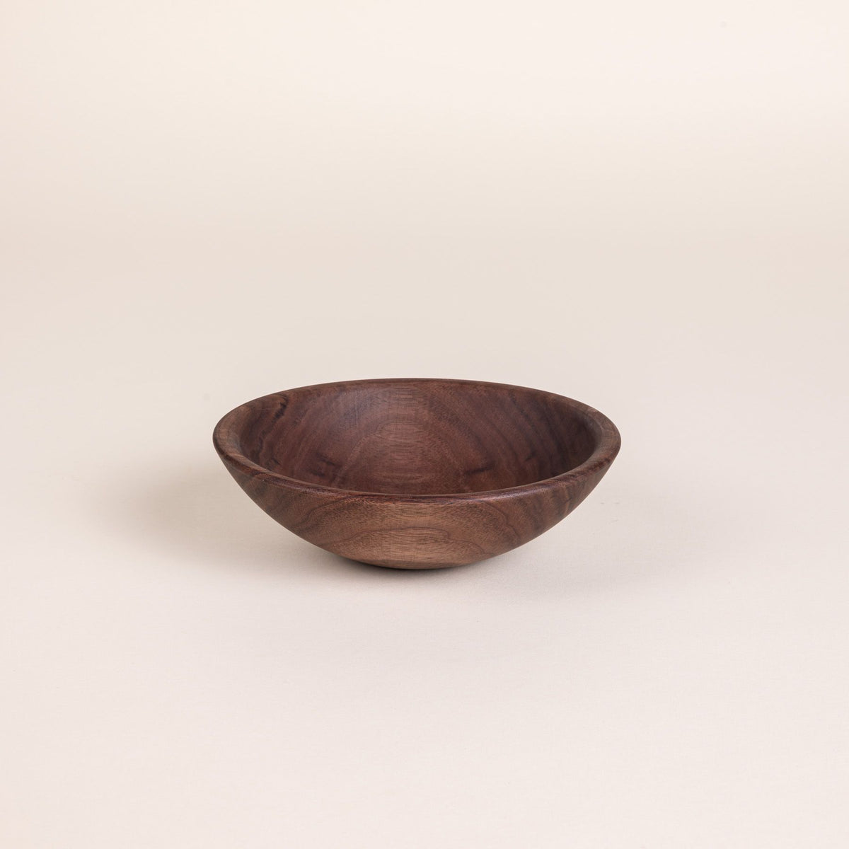 A small walnut wood bowl