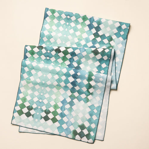 Watercolor diamond-patterned table runner in green and teal tones