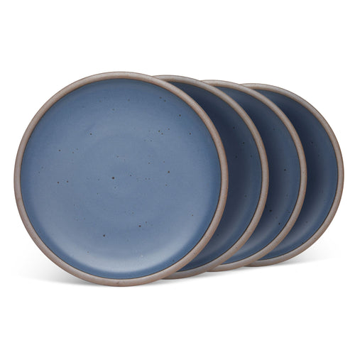 4 dinner sized ceramic plates in a cool, medium blue color featuring iron speckles and an unglazed rim