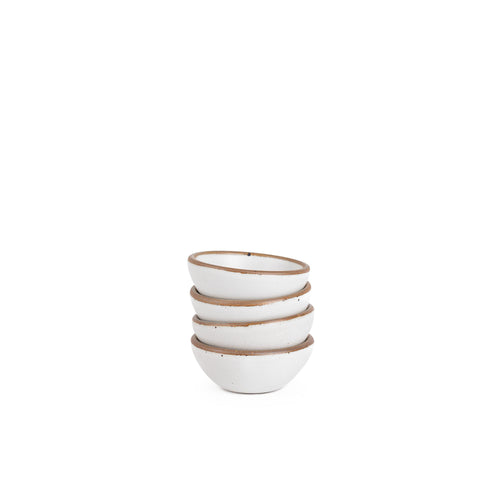 A stack of 4 tiny rounded ceramic bowls in a cool white color featuring iron speckles and an unglazed rim
