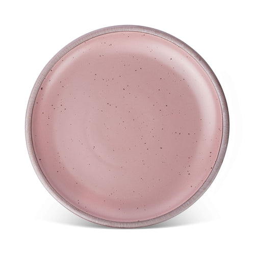 A large ceramic platter in a dusty mauve pink color featuring iron speckles and an unglazed rim.