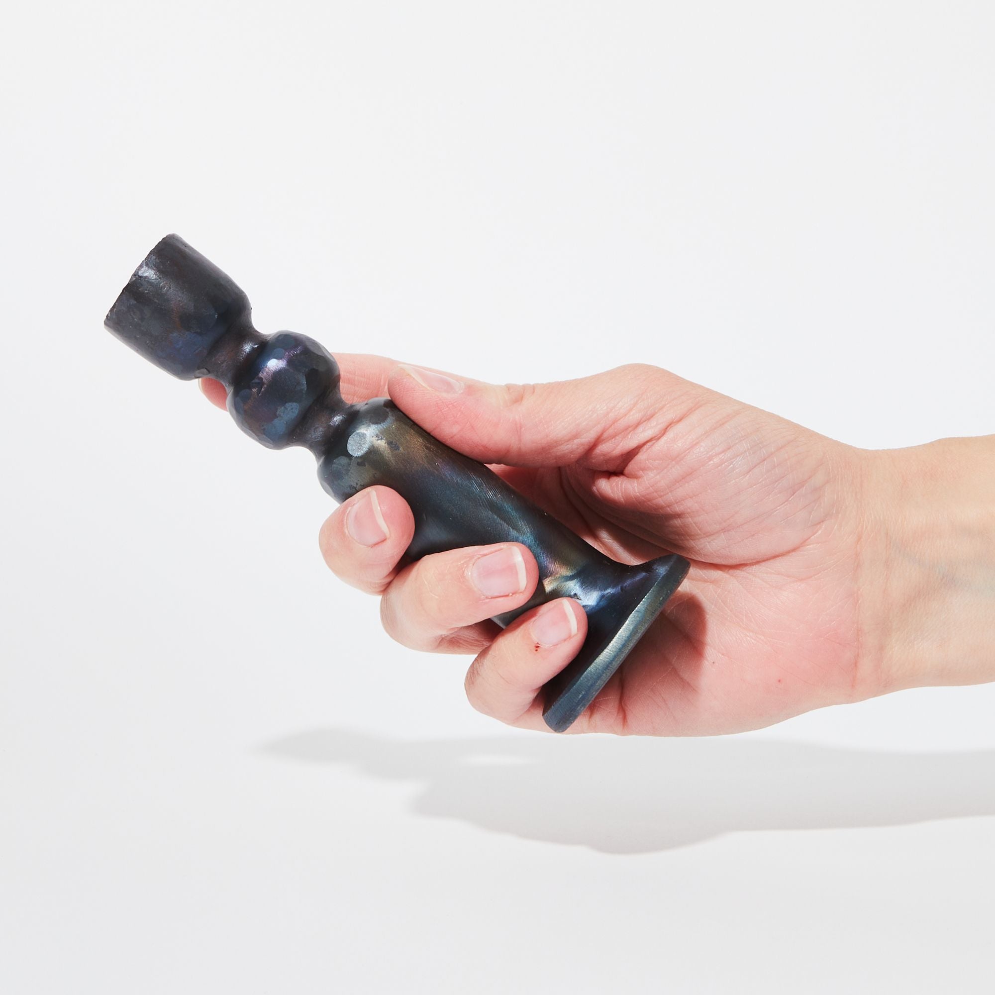 Iron Urbino Candlestick held in a hand