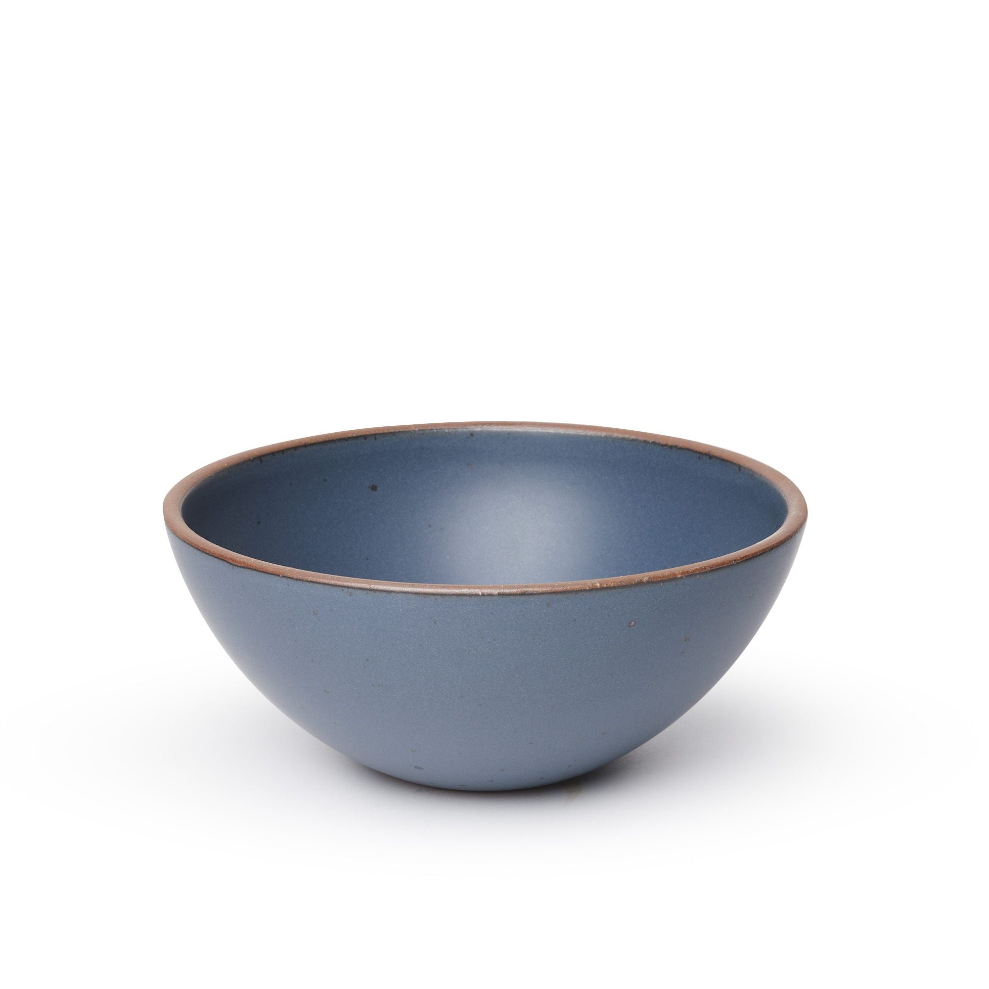 A large rounded ceramic bowl in a cool, medium blue color featuring iron speckles and an unglazed rim