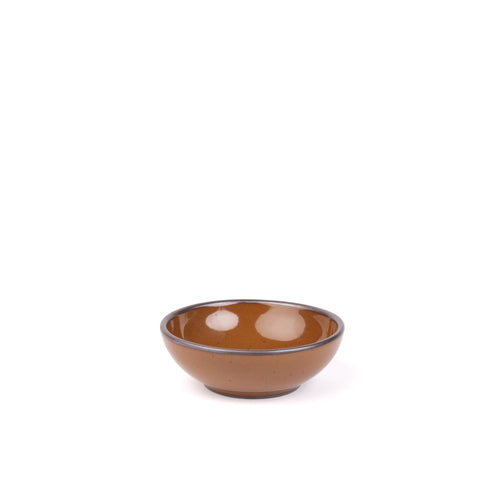 A small shallow ceramic bowl in a glossy caramel brown color featuring iron speckles and an unglazed rim