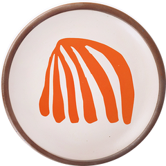 A ceramic dessert sized plates in a warm off-white color with unglazed rim, a frond-like cut-outs from Henri Matisse’s La Perruche et la sirène.