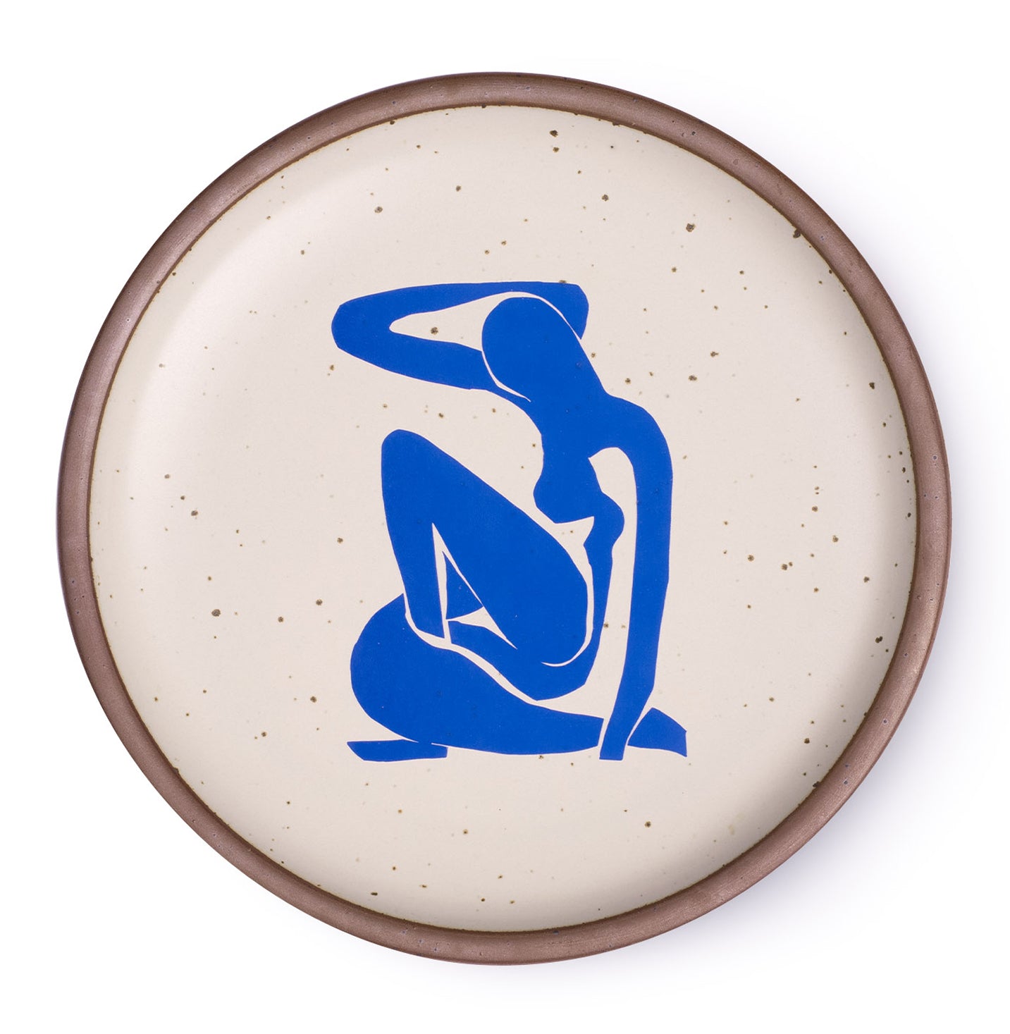 A plate featuring Nu Bleu I, by Henri Matisse, a bright blue, abstract, silhouetted female figure in a curled, seated position, with sharp cut-out edges, centered on an off-white ceramic plate with an unglazed rim.