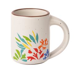 A full dip warm off-white mug with unglazed rim with colorful leaves decaled from Acanthes by Henri Matisse.
