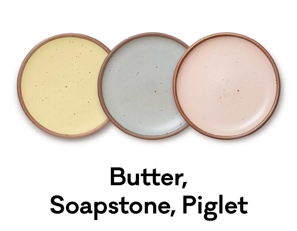 Soft yellow, blue and pink plates are positioned next to each other. Underneath it reads