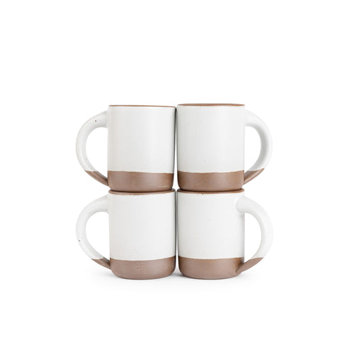 Four medium sized ceramic mugs with handles in a cool white color featuring iron speckles and unglFour medium sized ceramic mugs with handles in a cool white color featuring iron speckles and unglazed rim and bottom base, stacked in sets of 2.azed rim and bottom base, stacked in sets of 2.