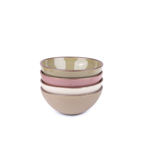 A stack of 4 medium sized rounded ceramic bowls in a reflective dappled grey-green, warm off-white, pale brown and dusty mauve pink colors featuring iron speckles and an unglazed rim
