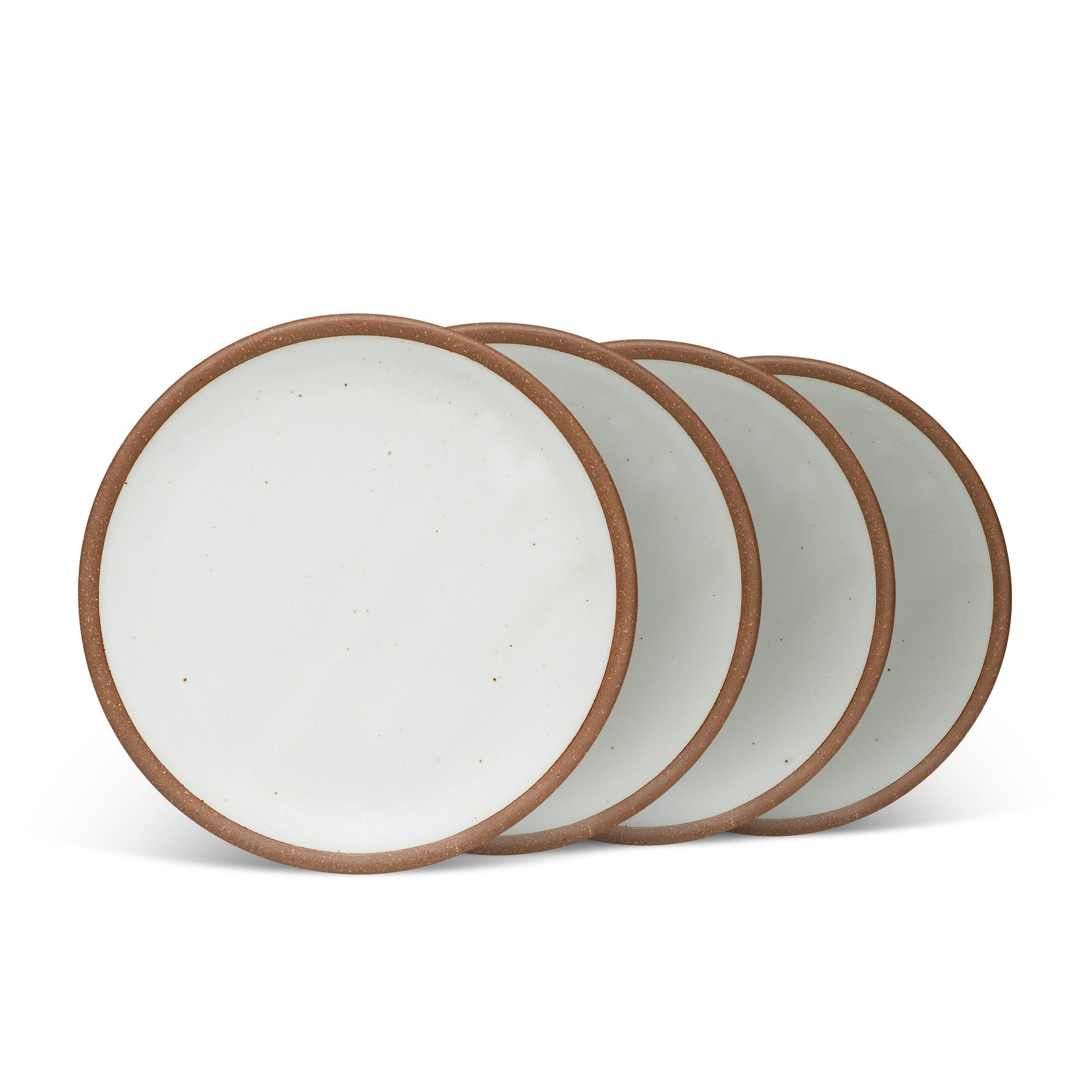 4 medium sized ceramic plates in a cool white color featuring iron speckles and an unglazed rim.