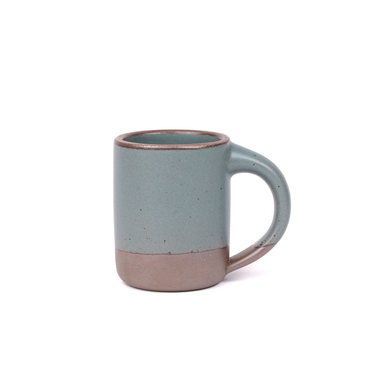 A medium sized ceramic mug with handle in a blue-grey color featuring iron speckles and unglazed rim.