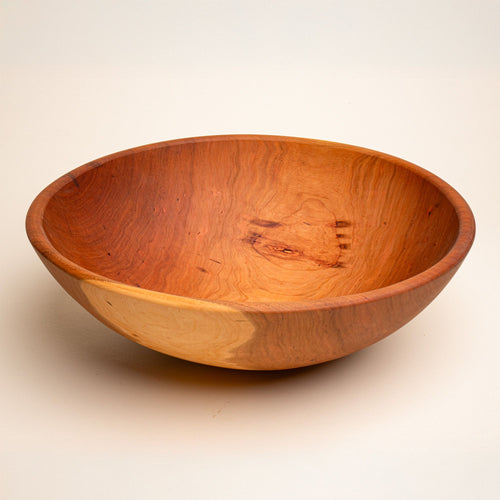 An extra large cherry wooden bowl