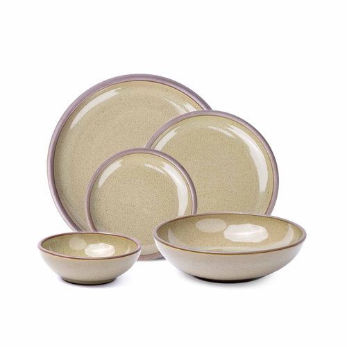 A breakfast bowl, everyday bowl, cake plate, side plate and dinner plate paired together in a reflective dappled grey-green featuring unglazed rims