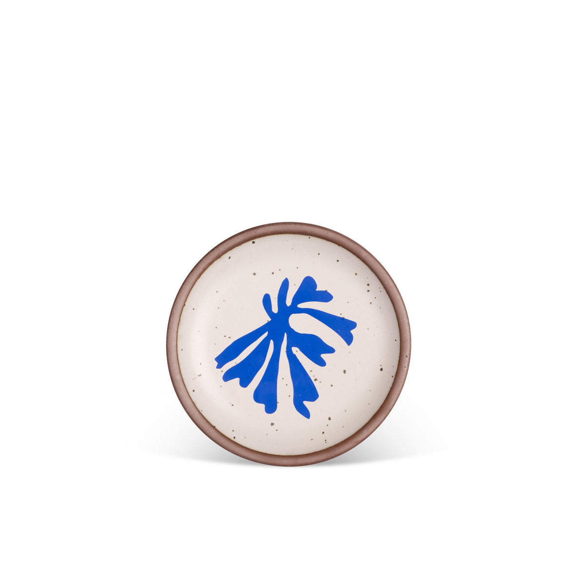 A ceramic dessert sized plates in a warm off-white color with unglazed rim, a frond-like cut-outs from Henri Matisse’s La Perruche et la sirène.