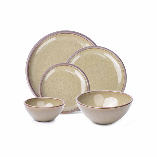 An ice cream bowl, soup bowl, cake plate, side plate and dinner plate in a reflective dappled grey-green color featuring an unglazed rim.
