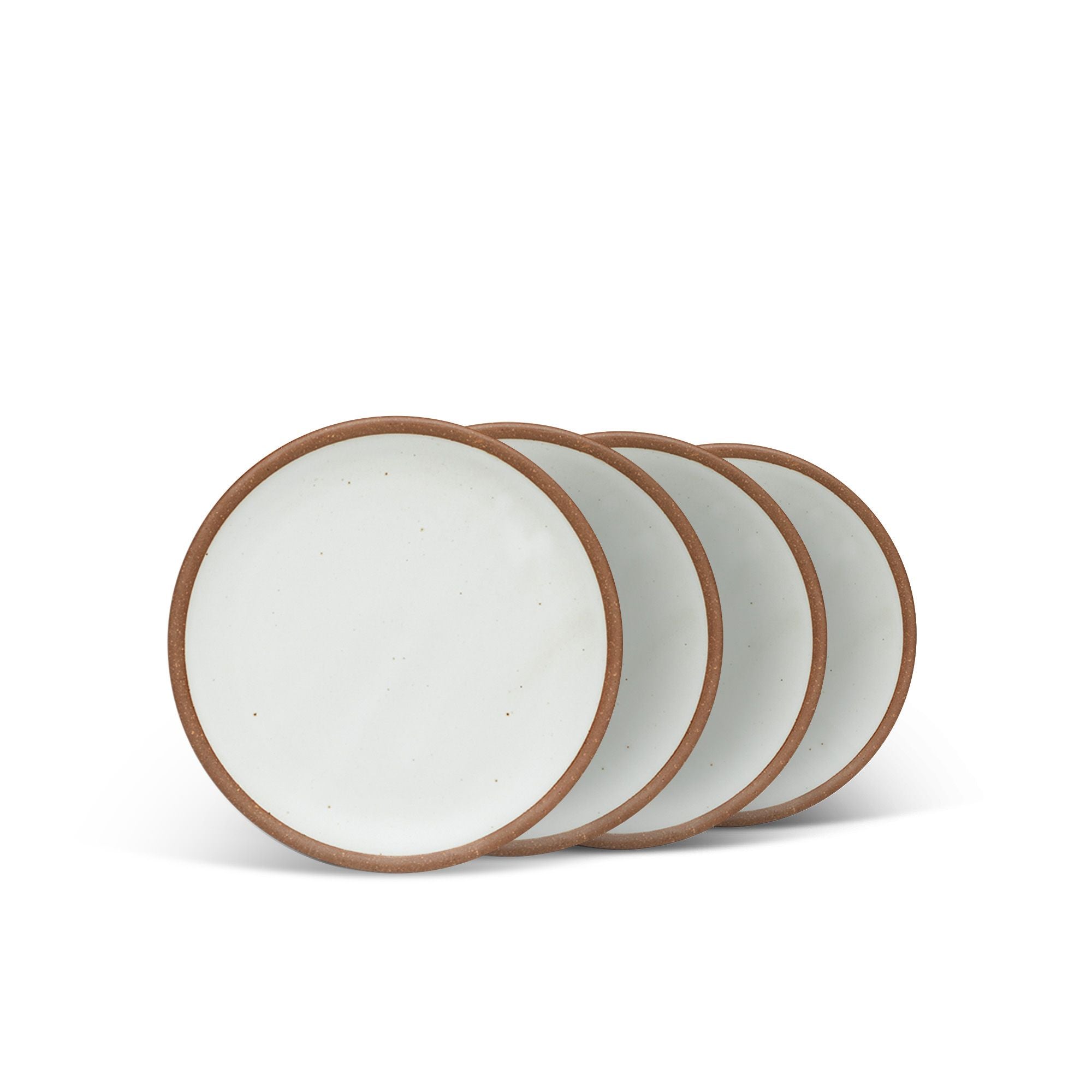 4 dessert sized ceramic plates in a cool white color featuring iron speckles and an unglazed rim.