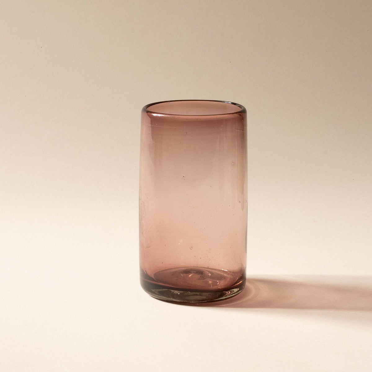 A light plum tall transparent drinking glass