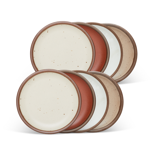 8 dessert sized ceramic plates in a cool terracotta, warm off-white, cool white, and warm pale brown color featuring iron speckles and an unglazed rim.