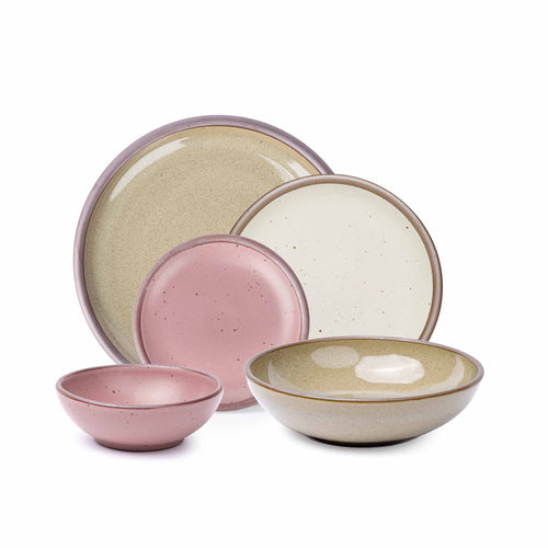 A breakfast bowl, everyday bowl, cake plate, side plate and dinner plate paired together in a dusty mauve pink, reflective dappled grey-green and warm off-white colors featuring iron speckles