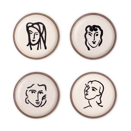 Four ceramic medium-sized plates in a warm off-white color with unglazed rim, featuring black aquatint portrait artworks by Henri Matisse.