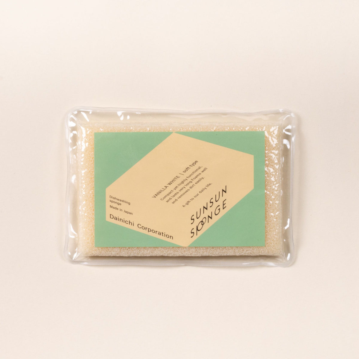 Vanilla-white dish sponge in clear packaging with a green Sunsun Sponge label on a light background.