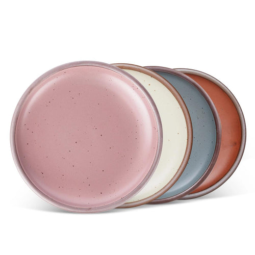4 dinner sized ceramic plates in a cool terracotta, warm off-white, blue-grey and dusty mauve pink colors featuring iron speckles and an unglazed rim
