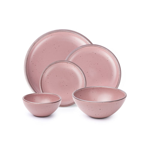An ice cream bowl, soup bowl, cake plate, side plate and dinner plate in a dusty mauve pink color featuring iron speckles