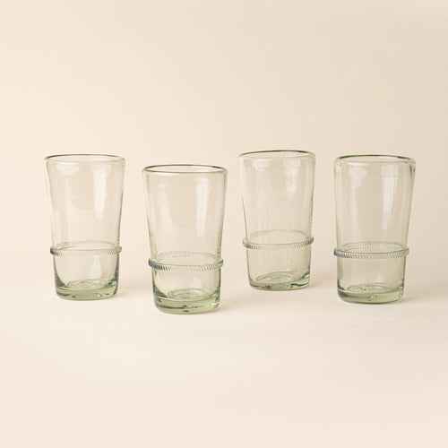 Set of four clear tall recycled glass tumblers with a ridged band detail.