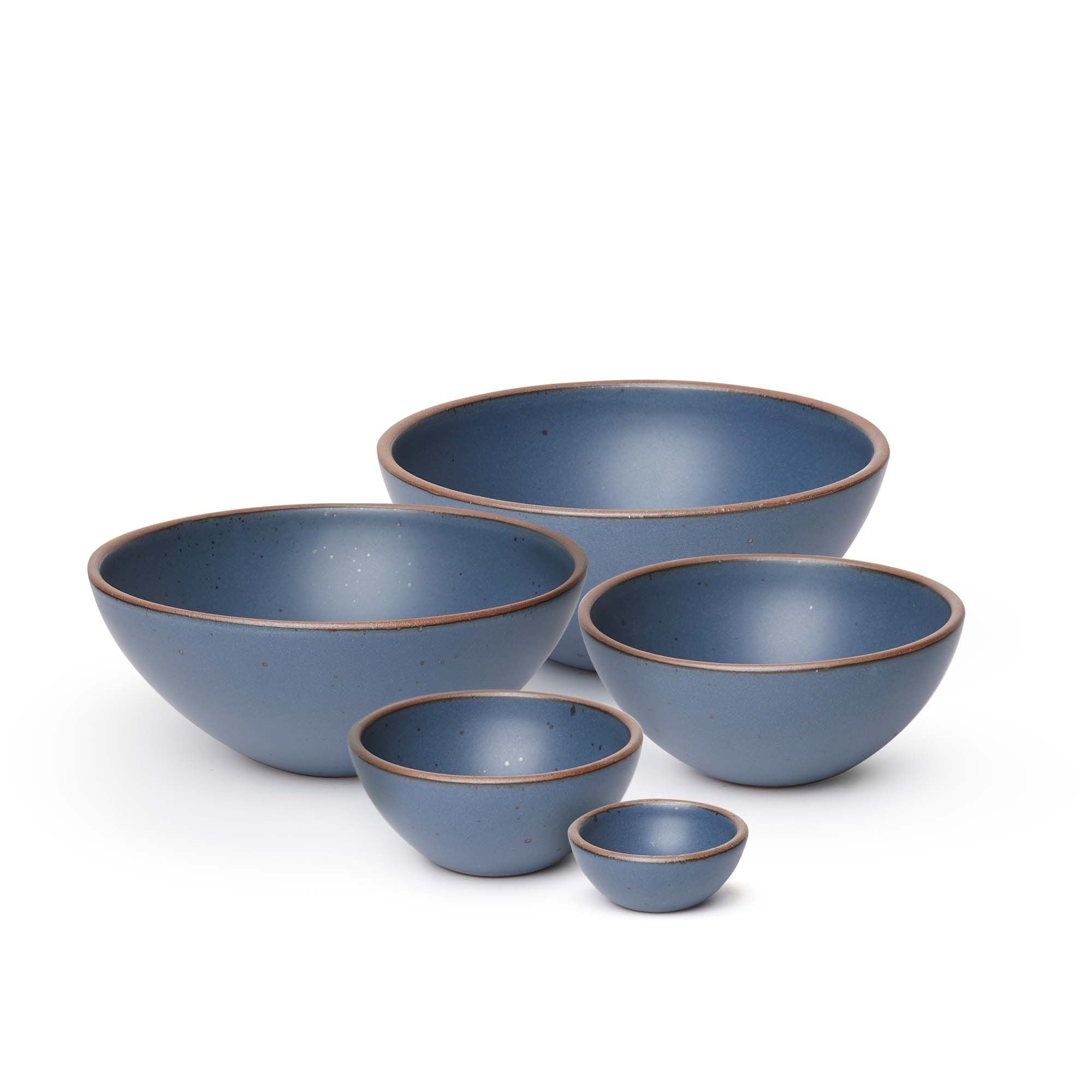 A bitty bowl, ice cream bowl, soup bowl, popcorn bowl, and mixing bowl paired together in a cool, medium blue color featuring iron speckles