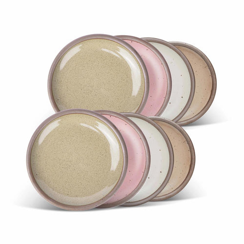 8 dessert sized ceramic plates in a reflective dappled grey-green, warm off-white, warm pale brown and dusty mauve pink colors featuring iron speckles and an unglazed rim.