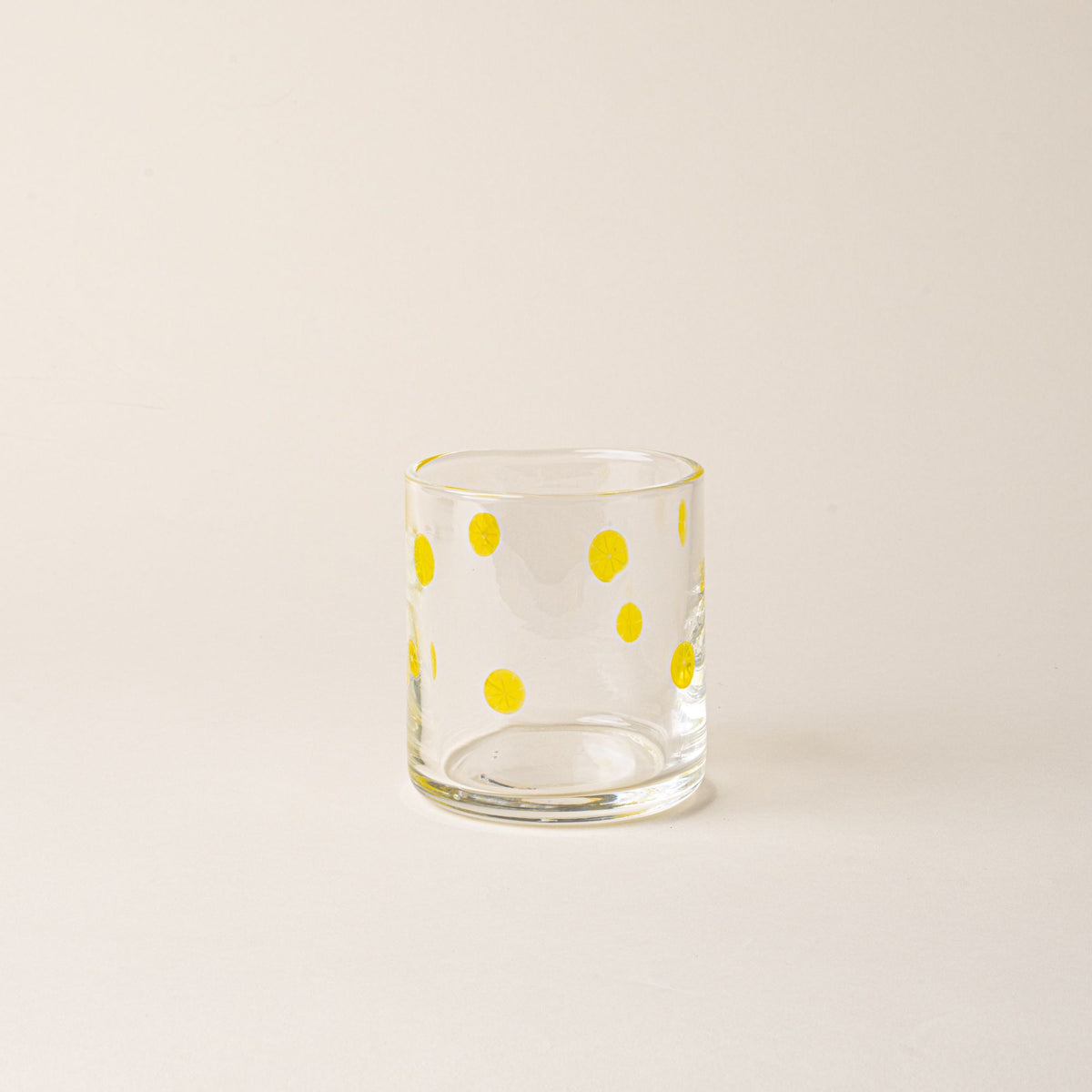 Clear glass tumbler with yellow lemon slice motif.