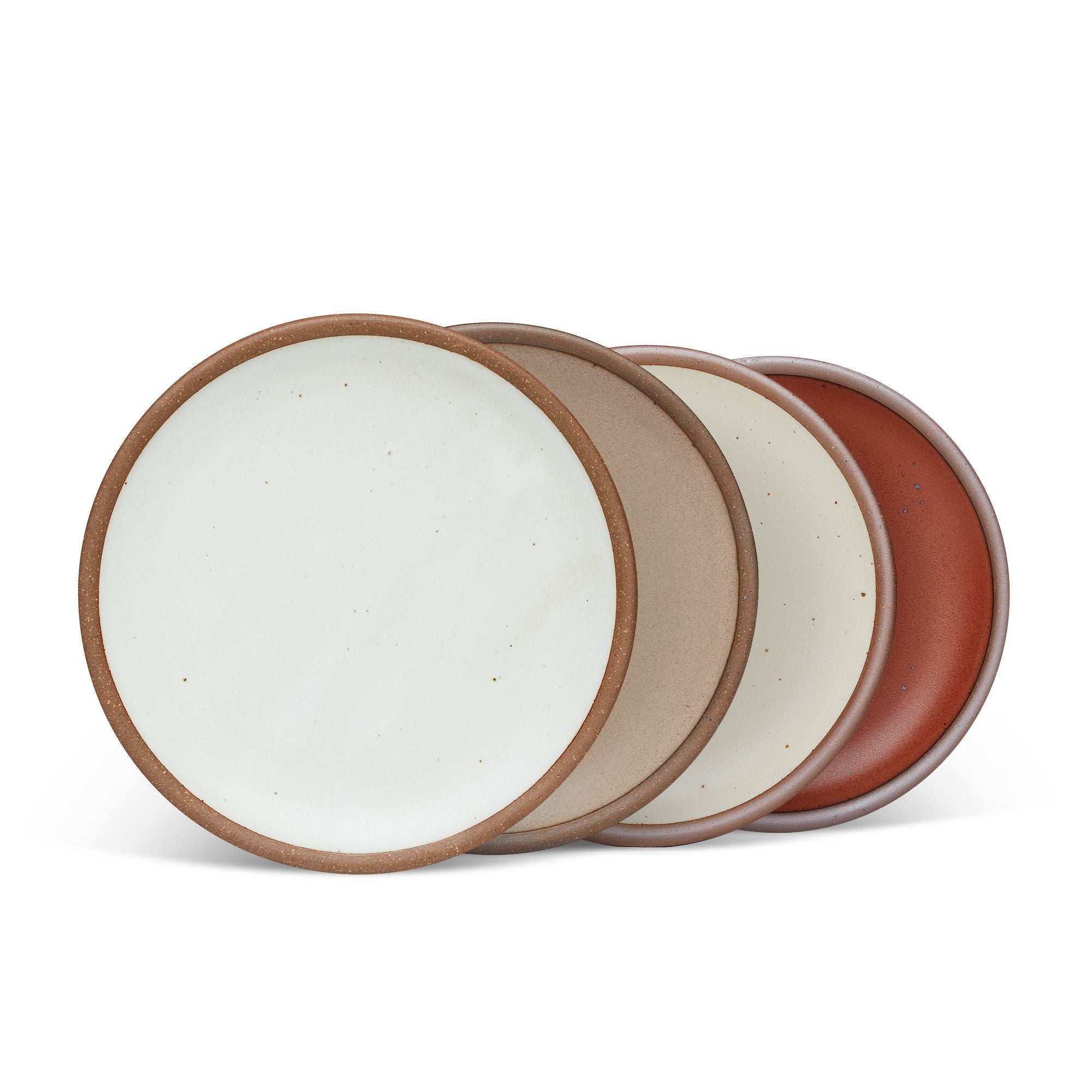 4 medium sized ceramic plates in a cool white, warm pale brown, warm off-white, and cool terracotta colors featuring iron speckles and an unglazed rim.