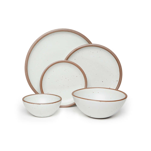 An ice cream bowl, soup bowl, cake plate, side plate and dinner plate paired together in a cool white featuring iron speckles