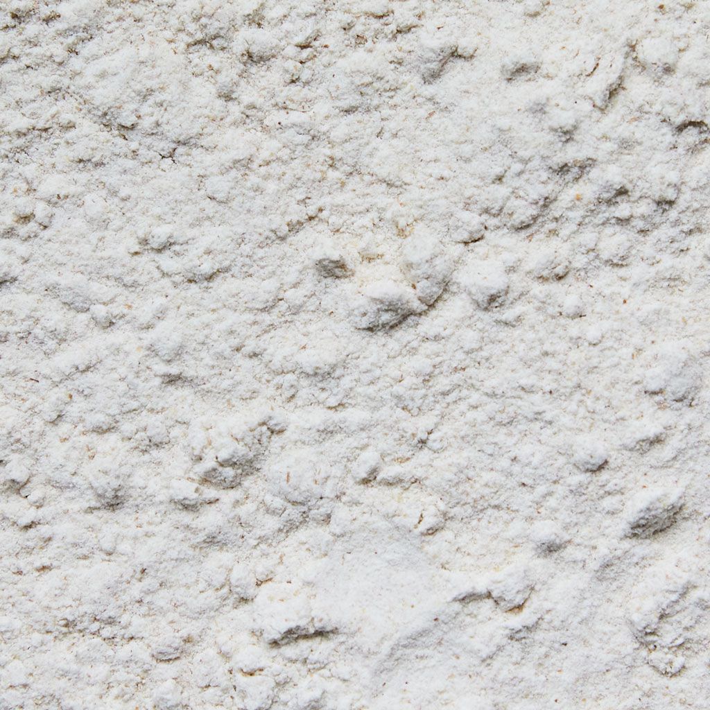 Close-up view of flour that looks off-white and somewhat lumpy