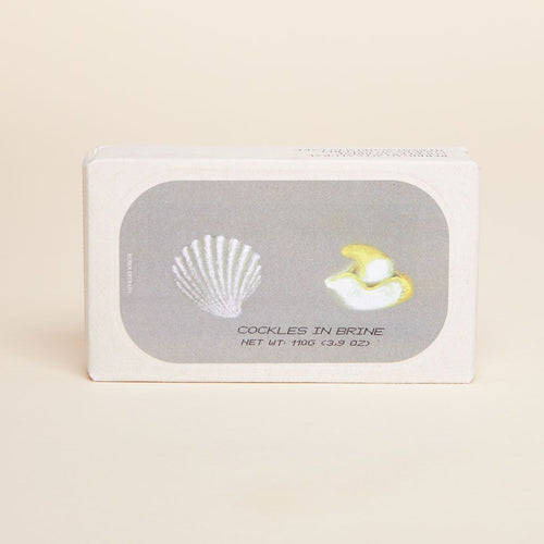 Brown rectangular box with illustrations of a shell and two cockles