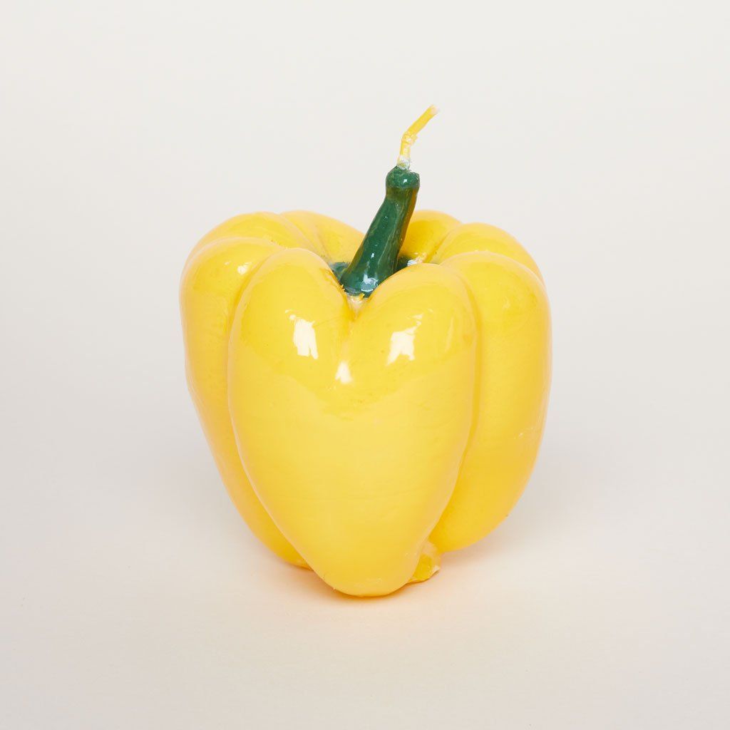 Good thing there is a wick sticking out of the top of this candle because with its shiny yellow body shaped like a pepper and its green stem, it does resemble the vegetable.