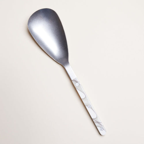 Larger-than-usual spoon for serving. Made in stainless steel with ivory acrylic handle.